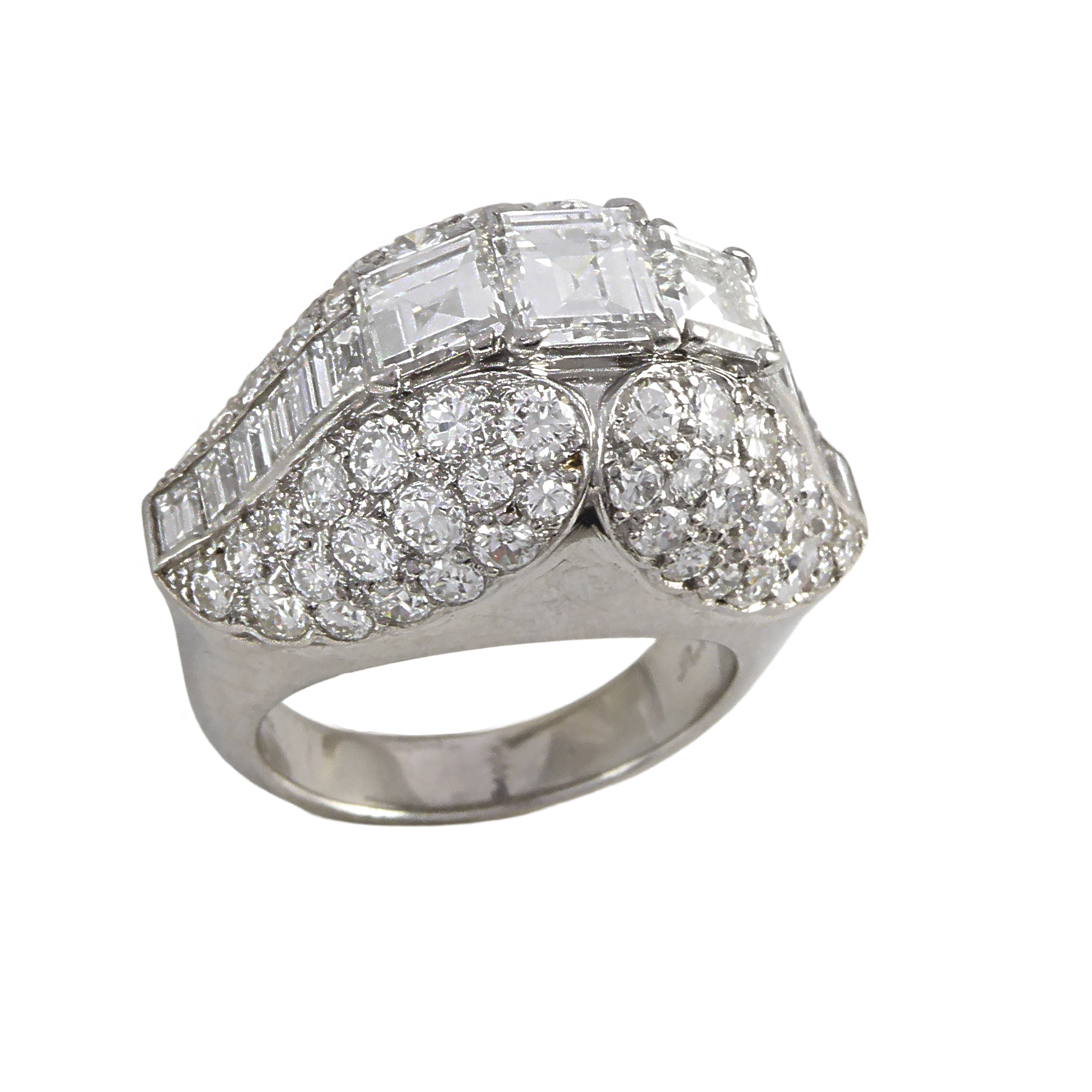 Diamond bombe cluster ring by Cartier, Paris, with three square cut diamonds raised in a twin tulip-petal form,